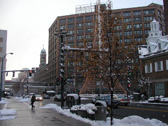 Happy Thanksgiving Picture Of The Day Rochester NY New York November 28th 2002 East Main Street Snowy Afternoon Liberty Decorated For The Holidays Sibley Tower Buidling Some Leaves Still Cling To A Tree with a view Of Dowtown Rochester Skyline Happy Thanksgiving Photo Photos Pictures Image Images